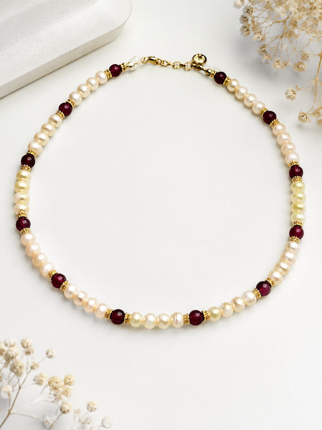 Niz & Aly Pearl Harmony necklace featuring freshwater pearls, red agate beads, and gold spacers in a balanced design.
