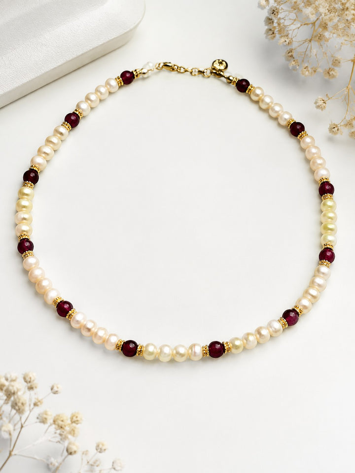 Niz & Aly Pearl Harmony necklace featuring freshwater pearls, red agate beads, and gold spacers in a balanced design.