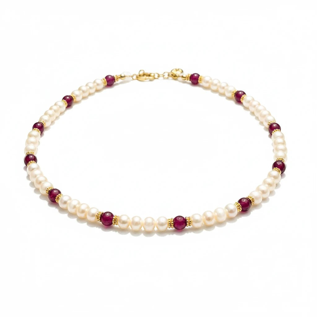 Niz & Aly Pearl Harmony necklace featuring freshwater pearls, red agate beads, and gold spacers on a white background.