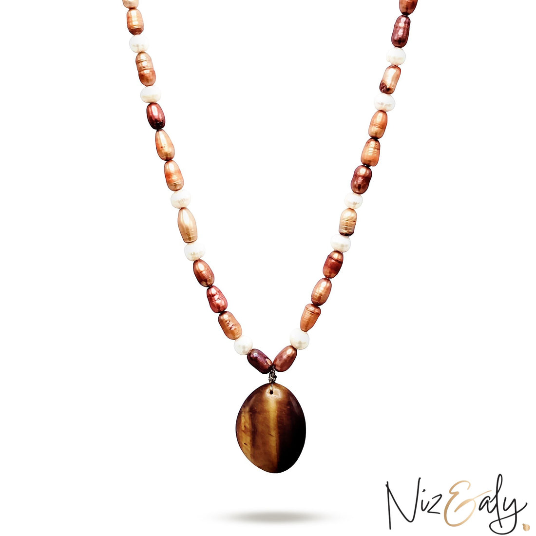 Niz & Aly freshwater pearl necklace featuring a polished oval tiger eye gemstone pendant in brown and white tones.