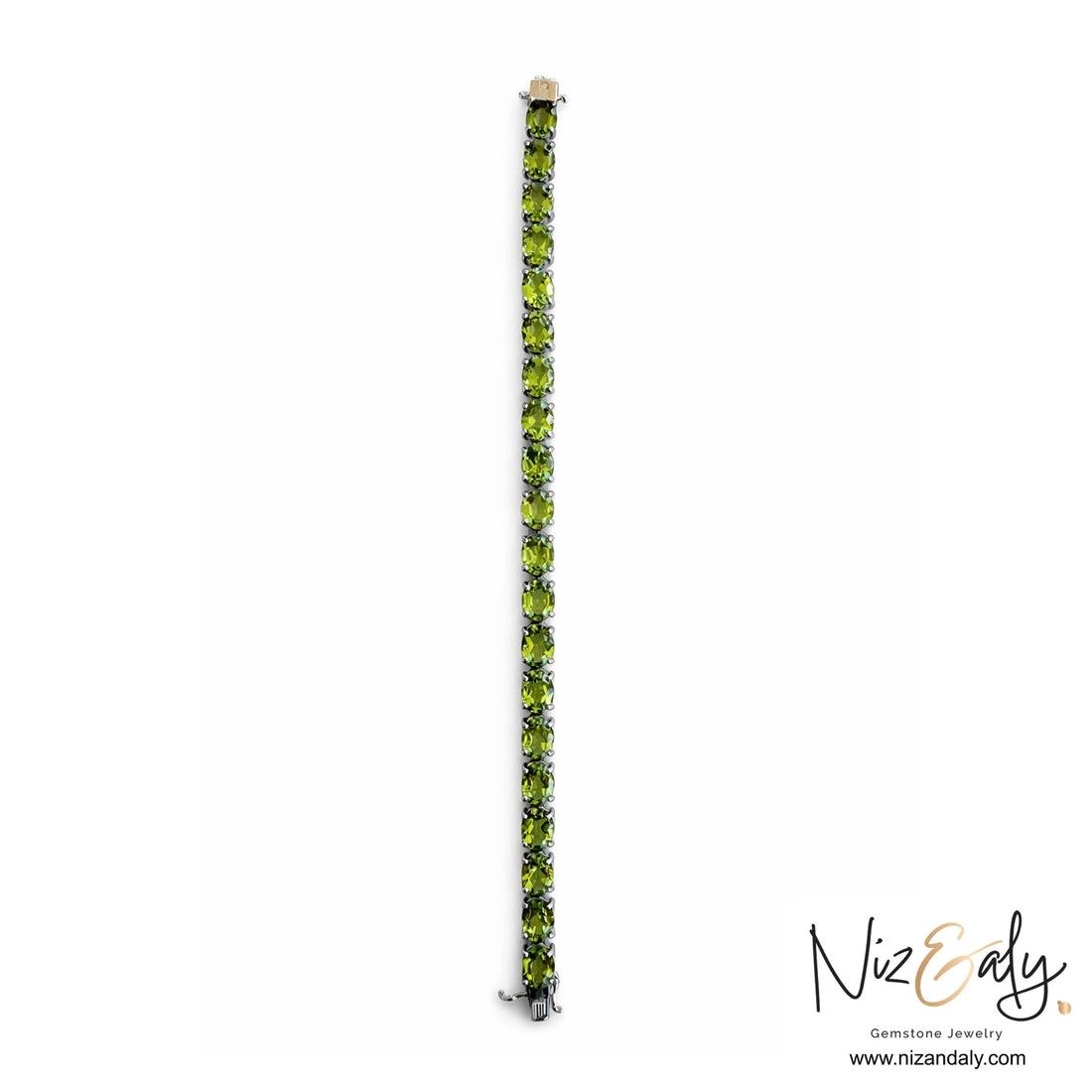 Niz & Aly tennis bracelet featuring 21 oval-cut natural peridot gemstones set in rhodium-plated 925 sterling silver.