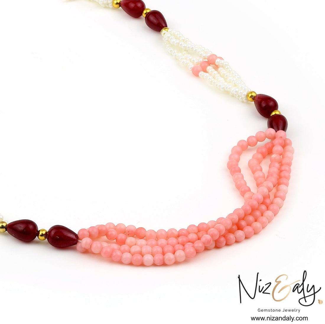 Niz & Aly multi-strand necklace featuring pink gemstone beads, white seed pearls, and deep red teardrop accents.