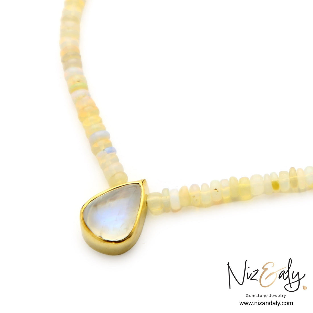 Niz & Aly 16-inch necklace with Ethiopian fire opal beads and a teardrop-shaped rainbow moonstone pendant in gold.
