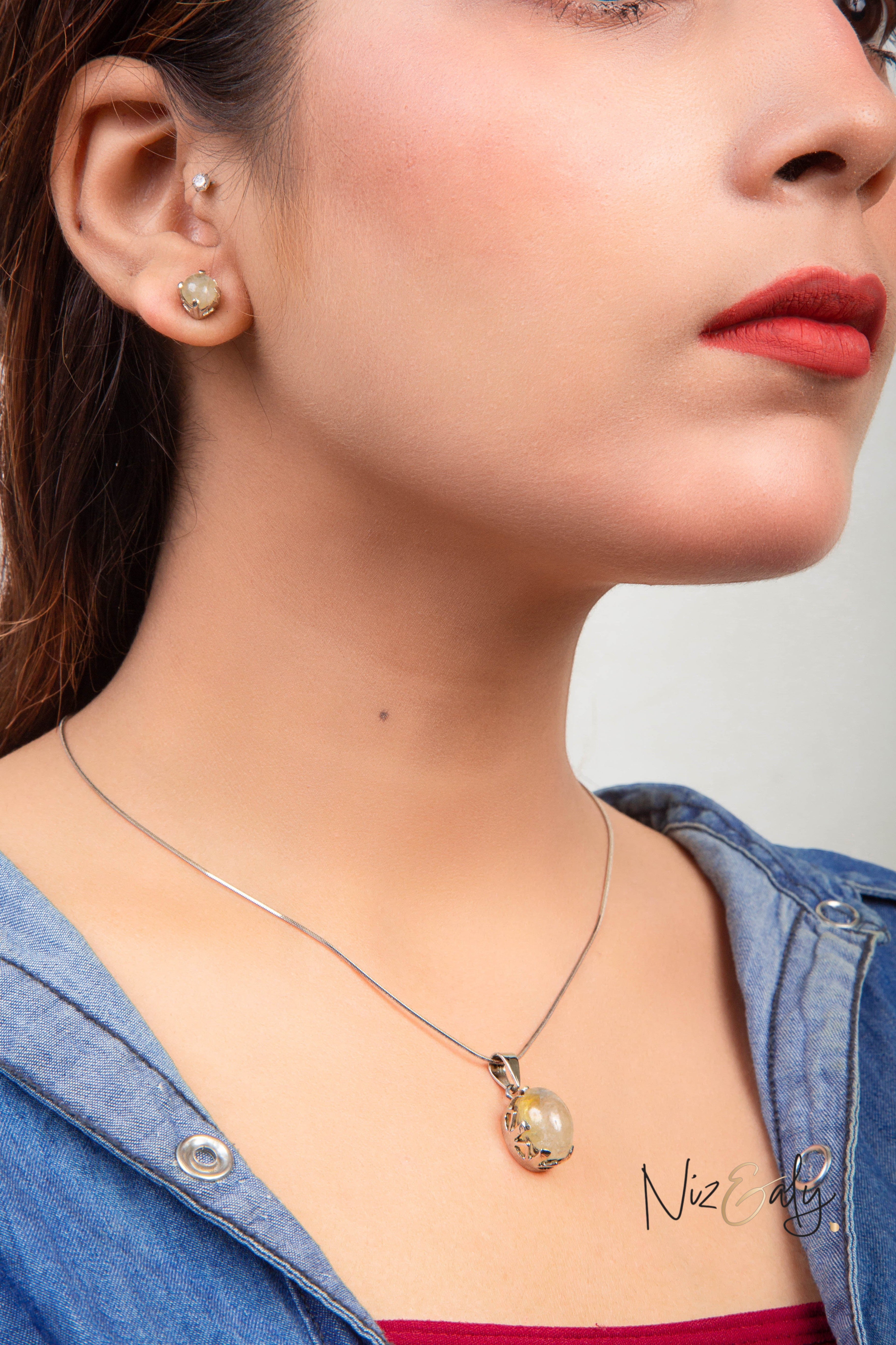 Niz & Aly Raw Citrine Bliss pendant and earring set worn by a woman, featuring rough golden-yellow citrine stones.
