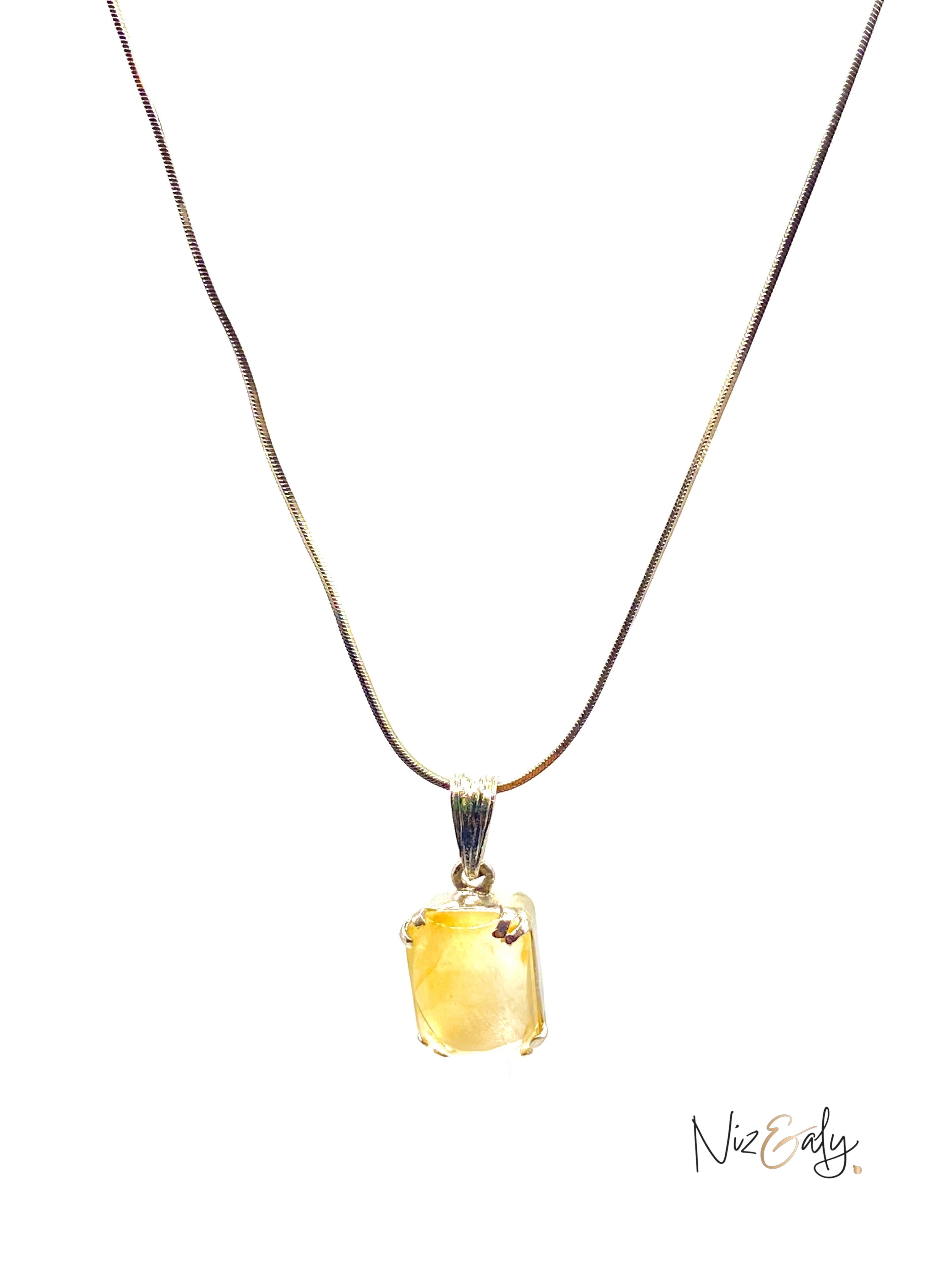 Niz & Aly raw citrine pendant necklace featuring a golden unpolished gemstone on a simple delicate chain