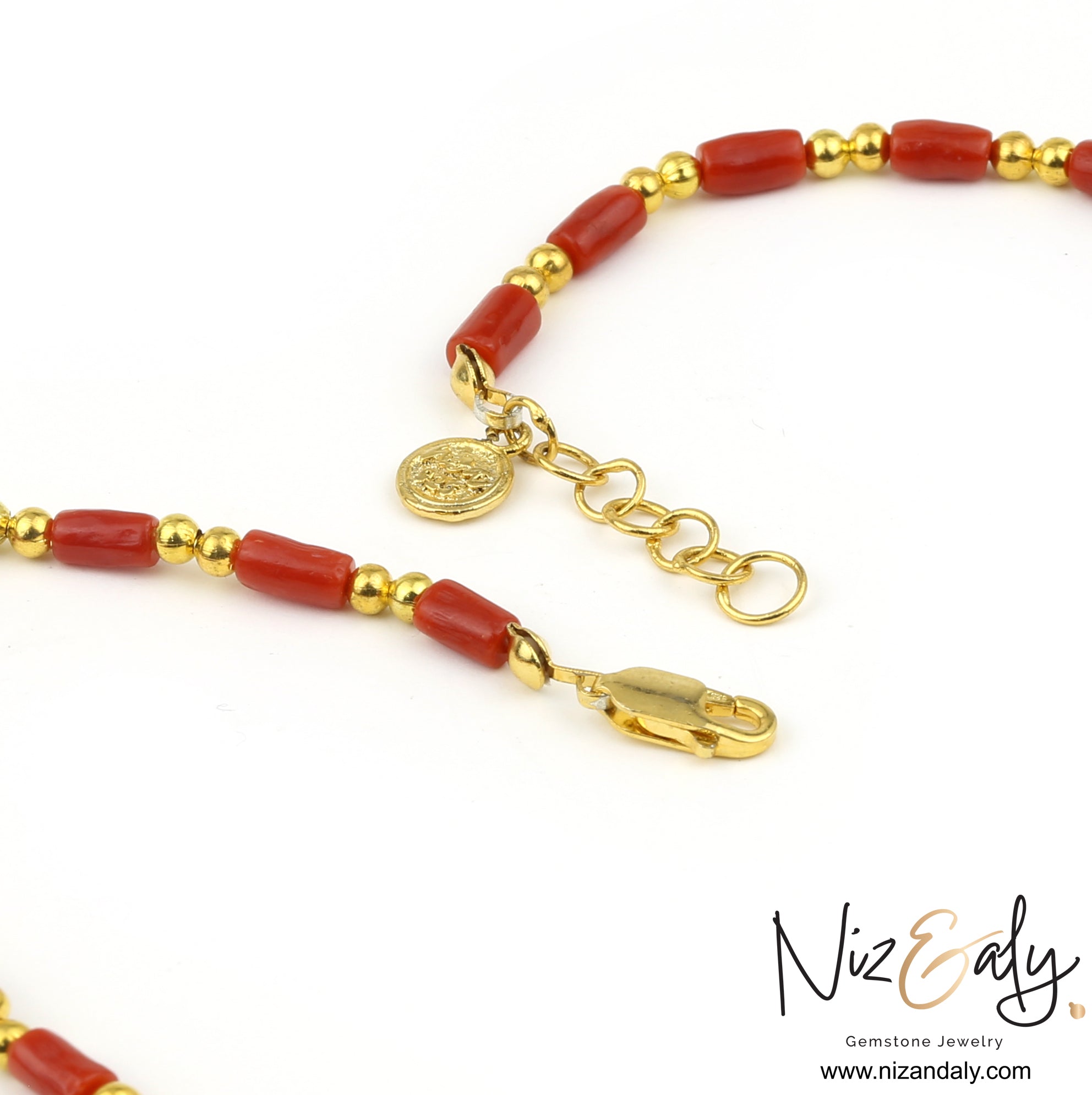 Niz & Aly natural red coral barrel bead necklace with polished gold round spacers and a gold coin charm clasp.