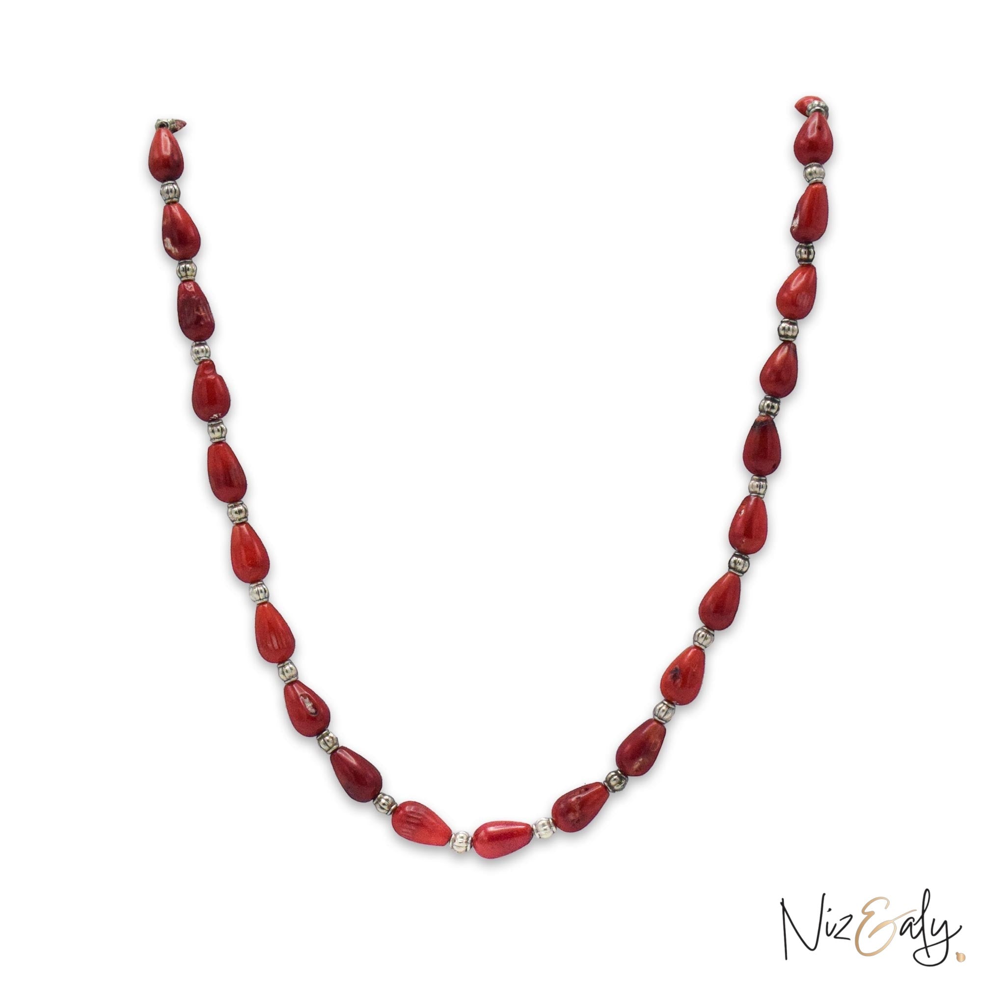 Niz & Aly Rosso Lacrima necklace featuring natural red coral teardrop beads separated by small silver spacers