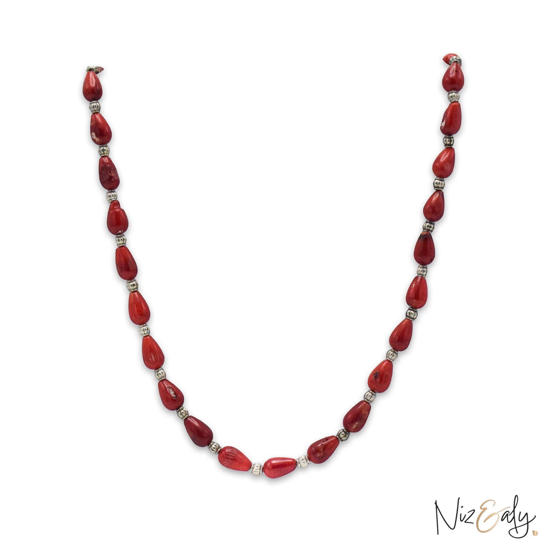 Niz & Aly Rosso Lacrima necklace featuring natural red coral teardrop beads separated by small silver spacers