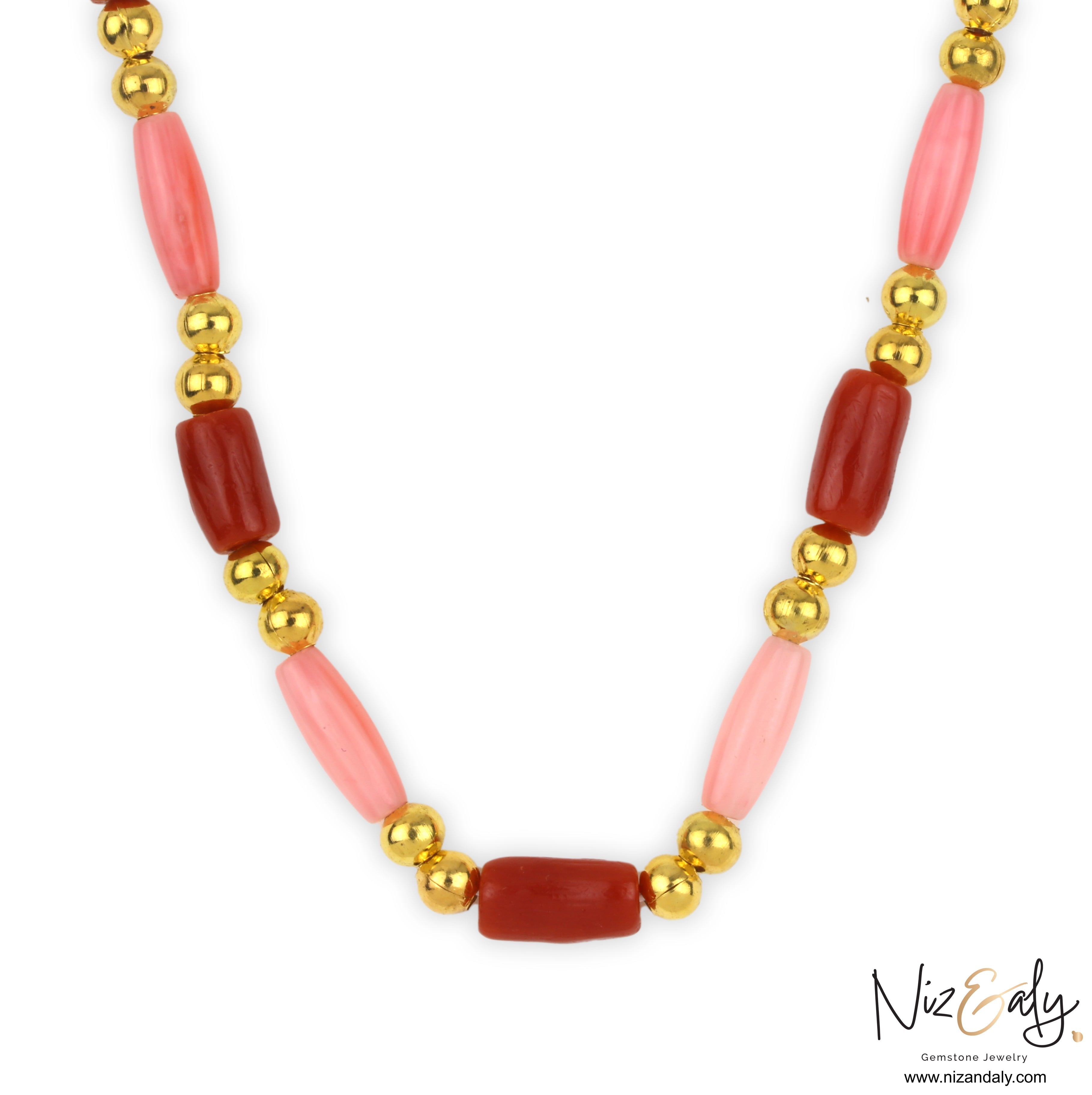 Niz & Aly dainty necklace featuring red and pink rice-shaped coral beads accented with polished gold spheres.
