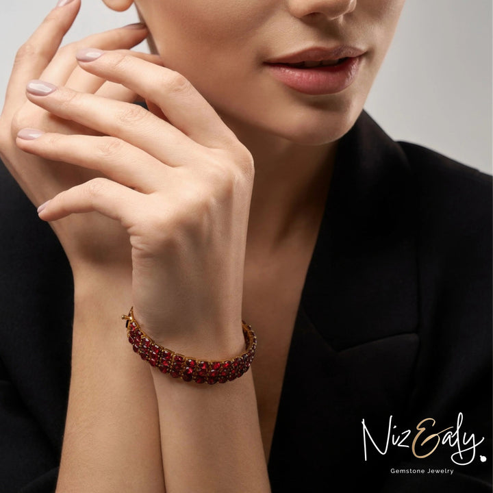 Niz & Aly multi-row rhodolite garnet bracelet featuring marquise-cut red stones set in 14K gold-plated sterling silver.
