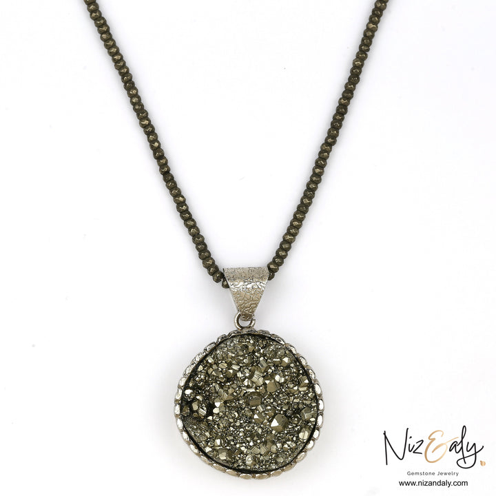 Niz & Aly round pyrite pendant necklace with faceted pyrite beads and metallic gold luster gemstone texture