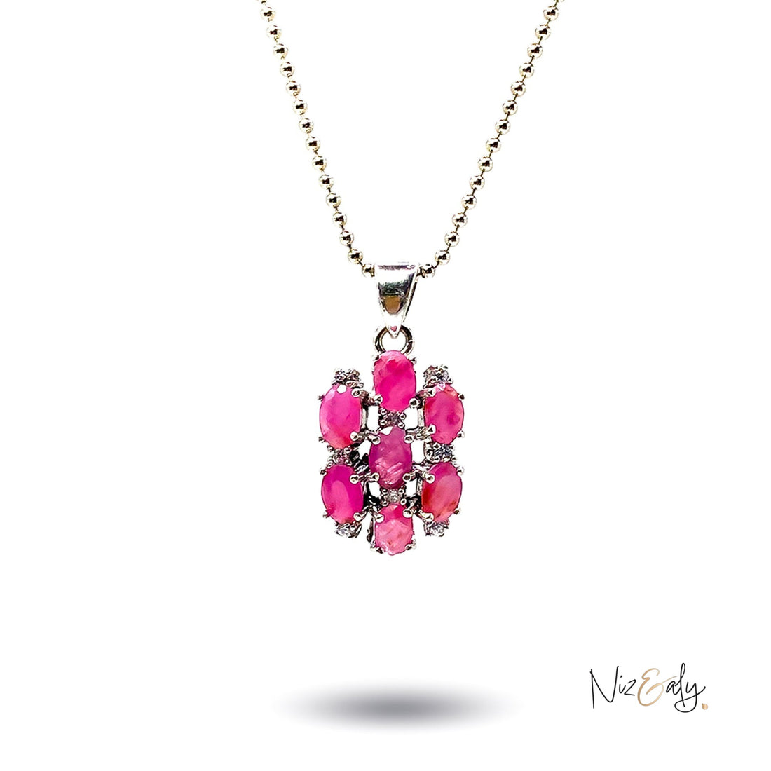 Niz & Aly cluster pendant featuring seven oval-cut vibrant red rubies set in silver on a delicate beaded chain