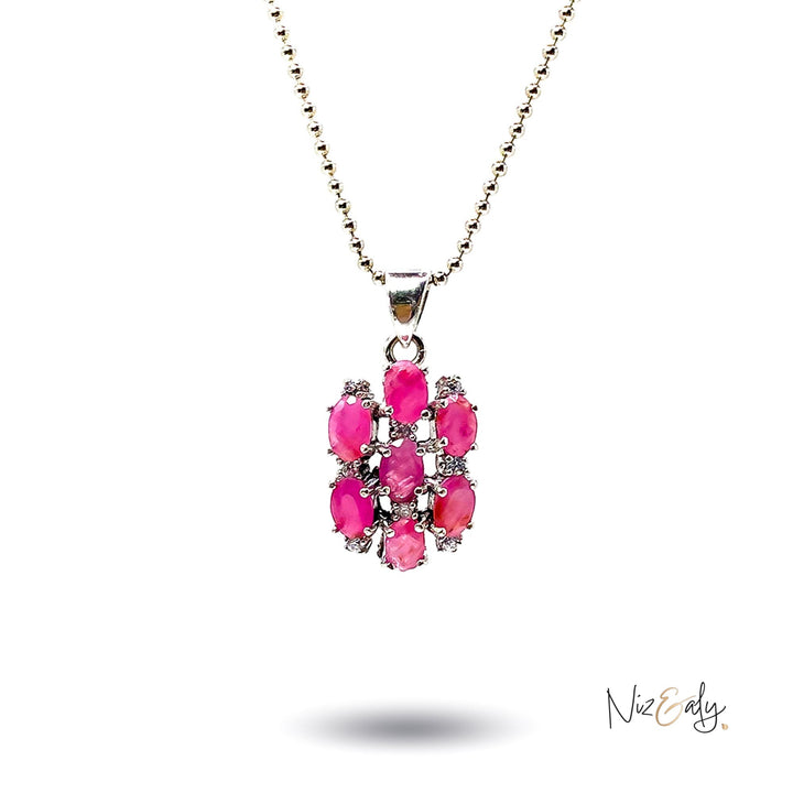 Niz & Aly cluster pendant featuring seven oval-cut vibrant red rubies set in silver on a delicate beaded chain