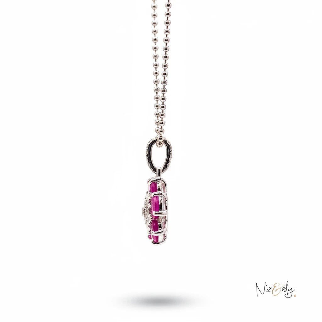 Niz & Aly red ruby flower pendant with five rubies and intricate silver center on a delicate silver chain