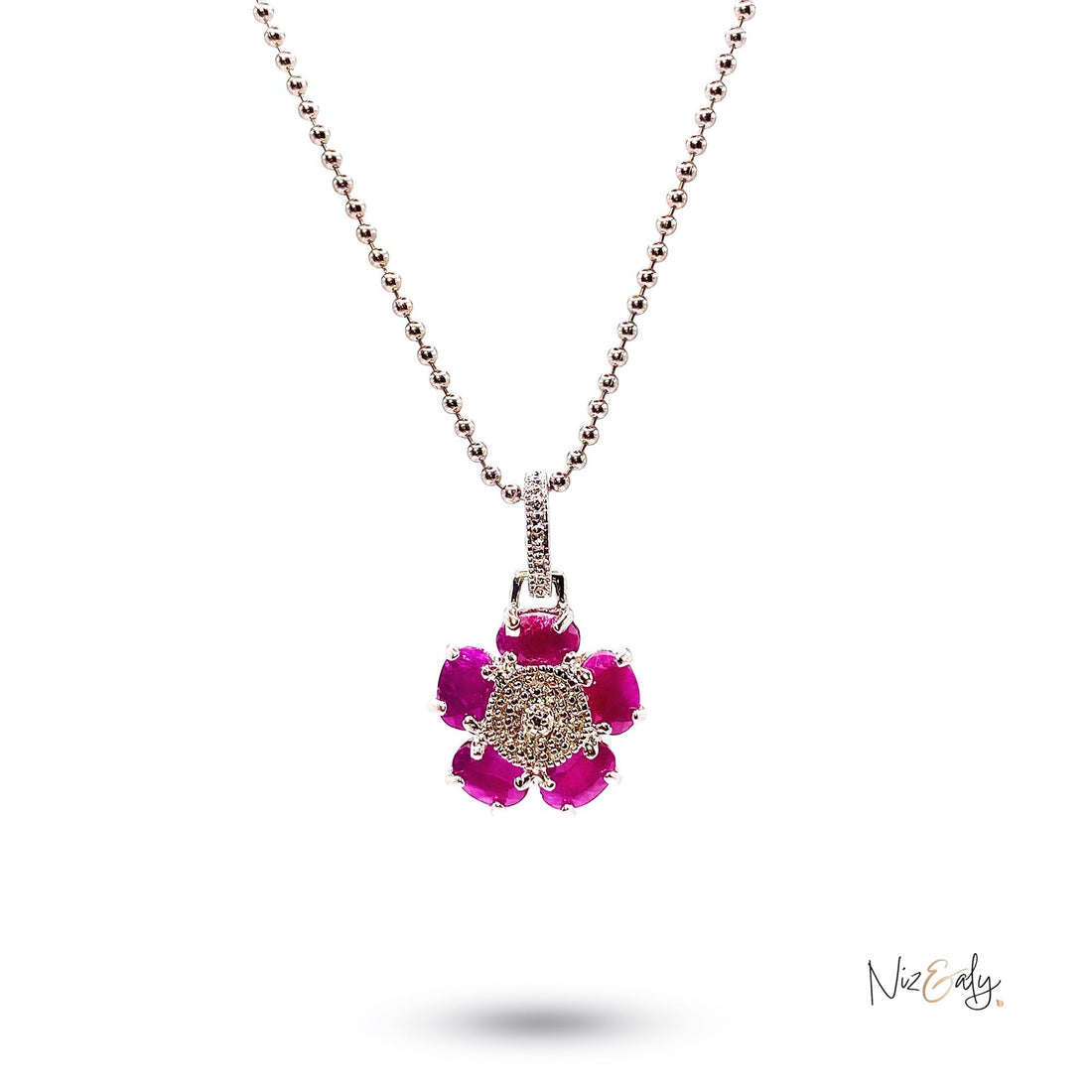 Niz & Aly flower pendant featuring five vibrant red rubies and an intricate silver center on a delicate bead chain.