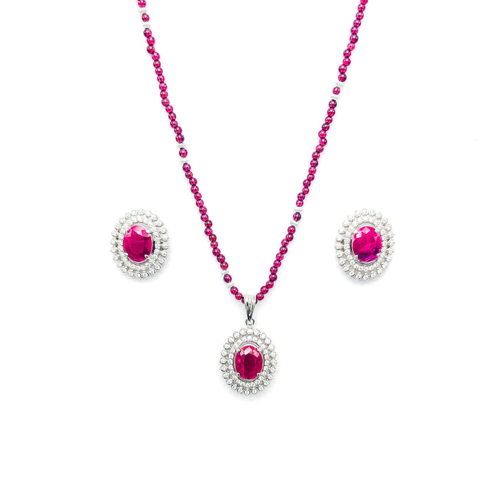 Niz & Aly African ruby pendant and earring set with a garnet bead necklace and diamond halo settings.