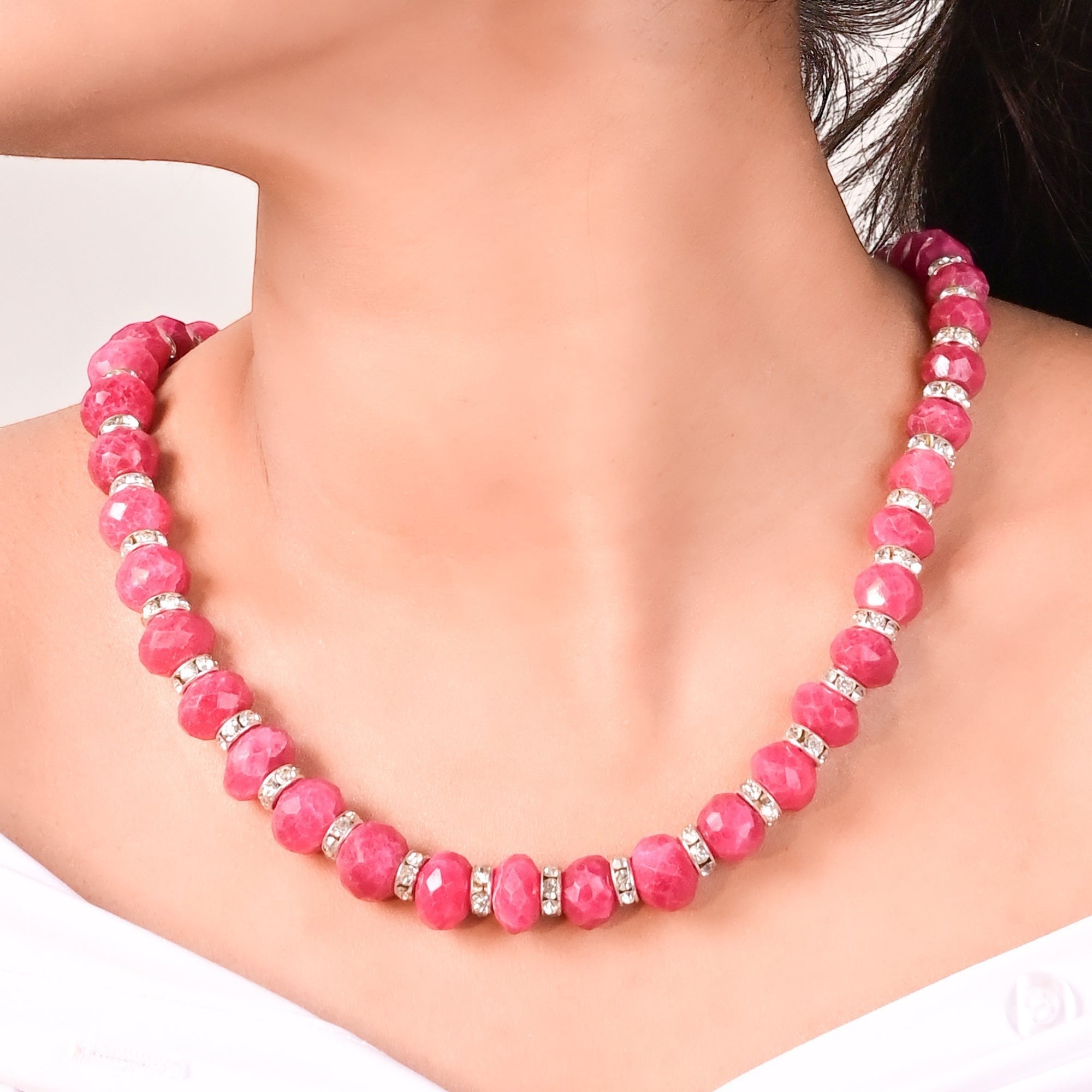 Niz & Aly ruby red faceted jade graduated necklace with silver crystal spacers worn on a model