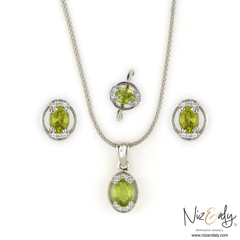 Niz & Aly Sage Dawn oval Arizona peridot pendant, ring, and earring set in silver with diamond accents.
