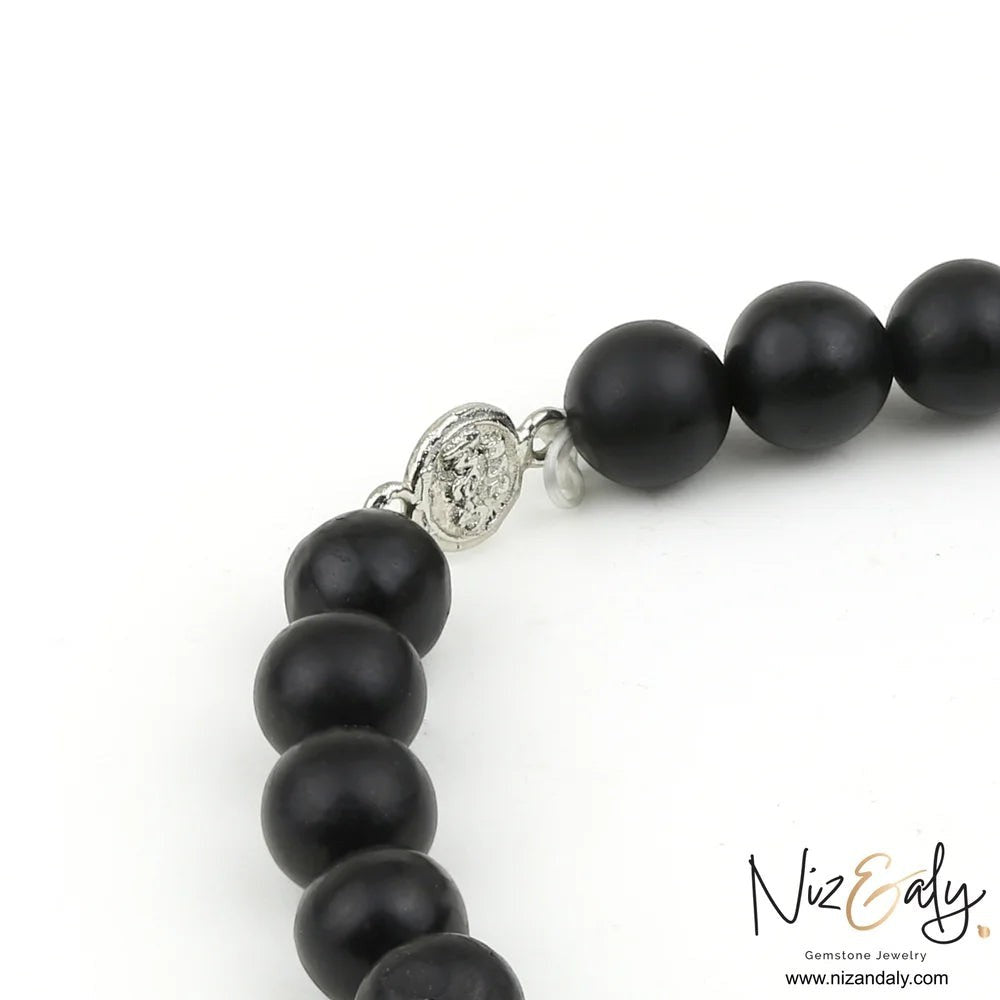 Niz & Aly genuine Shungite stretch bracelet with a polished 925 sterling silver accent bead on a white background.