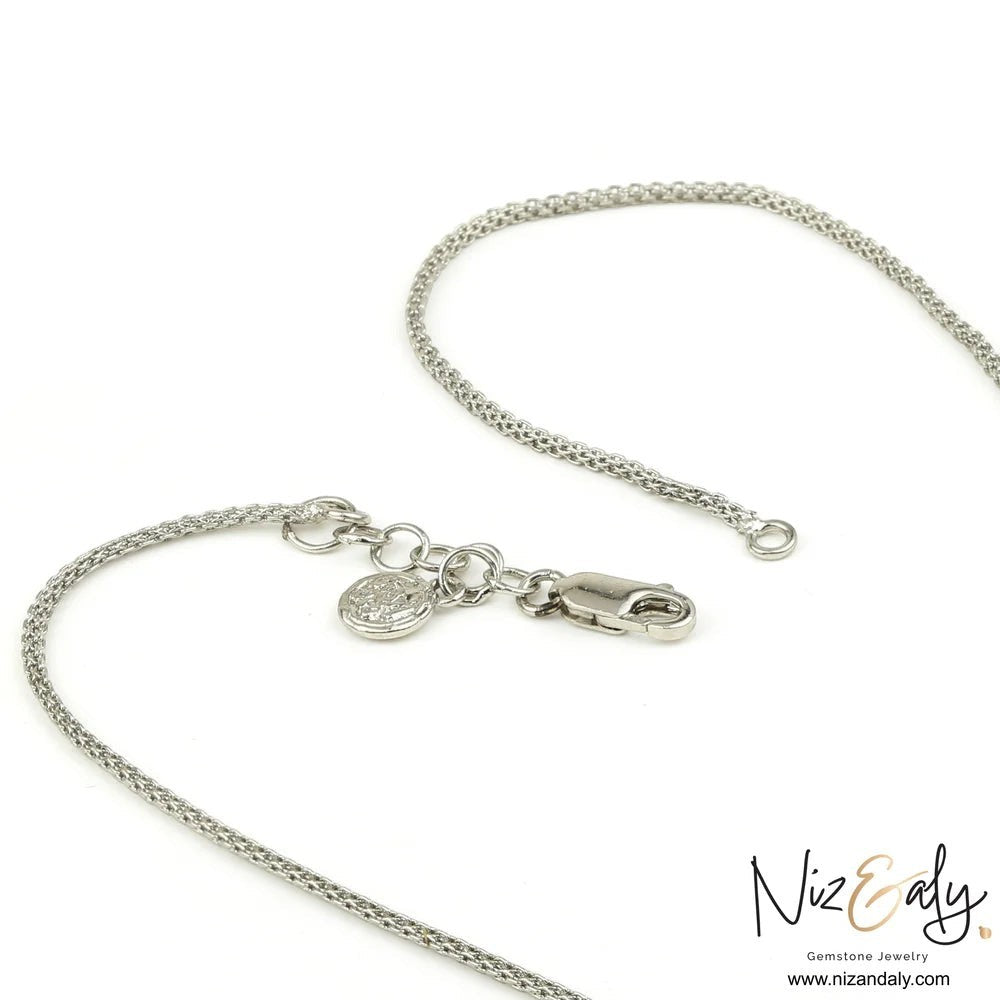 Niz & Aly silver chain necklace with a lobster clasp and branded charm on a white background.