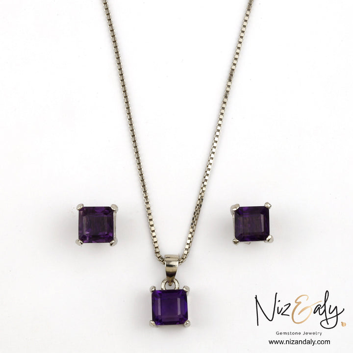 Niz & Aly square-cut amethyst pendant and matching stud earrings set in silver, featuring deep purple faceted stones.