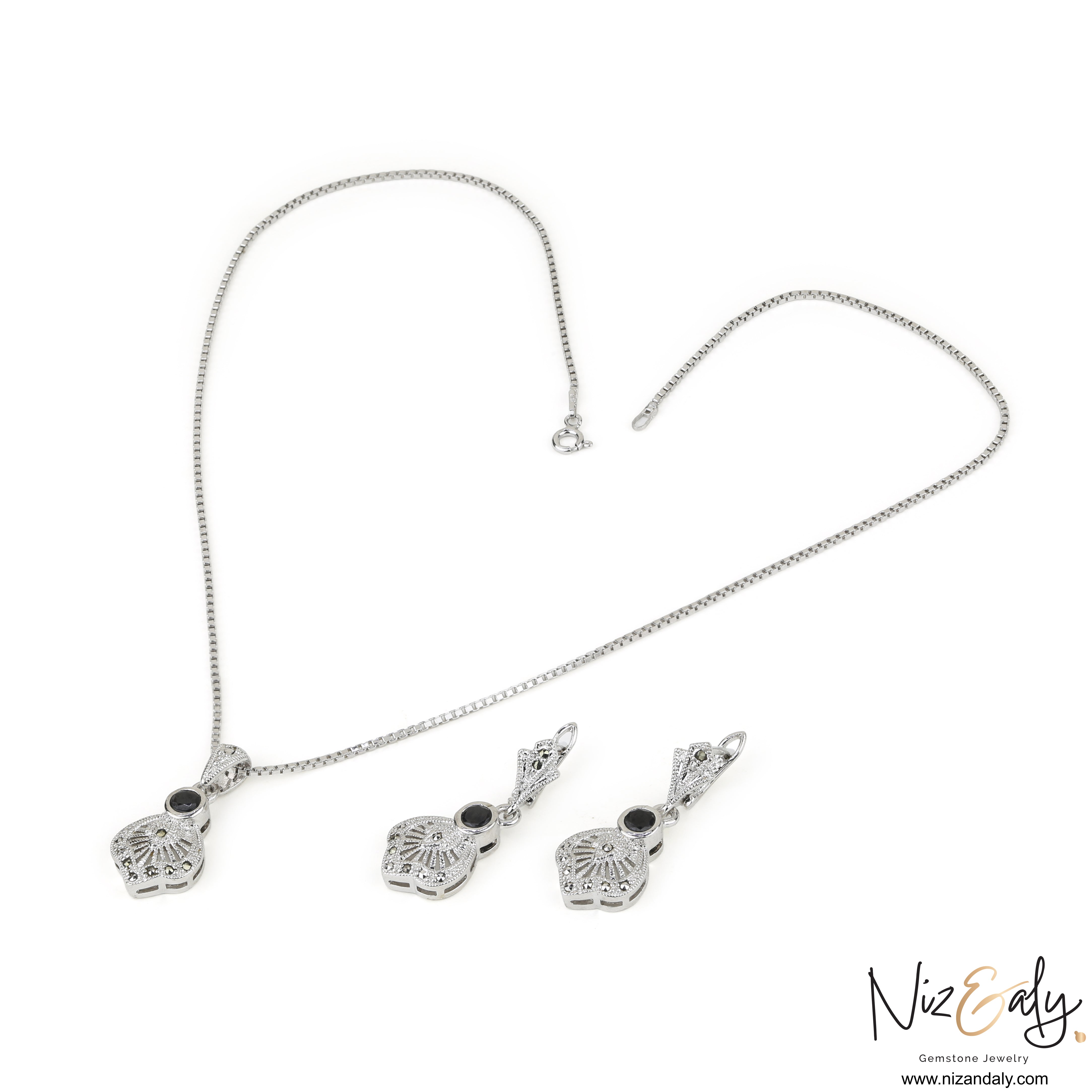 Niz & Aly sterling silver jewelry set featuring a black agate pendant and matching earrings with vintage star motifs.