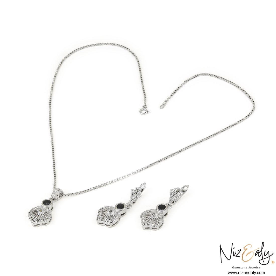 Niz & Aly sterling silver jewelry set featuring a black agate pendant and matching earrings with vintage star motifs.