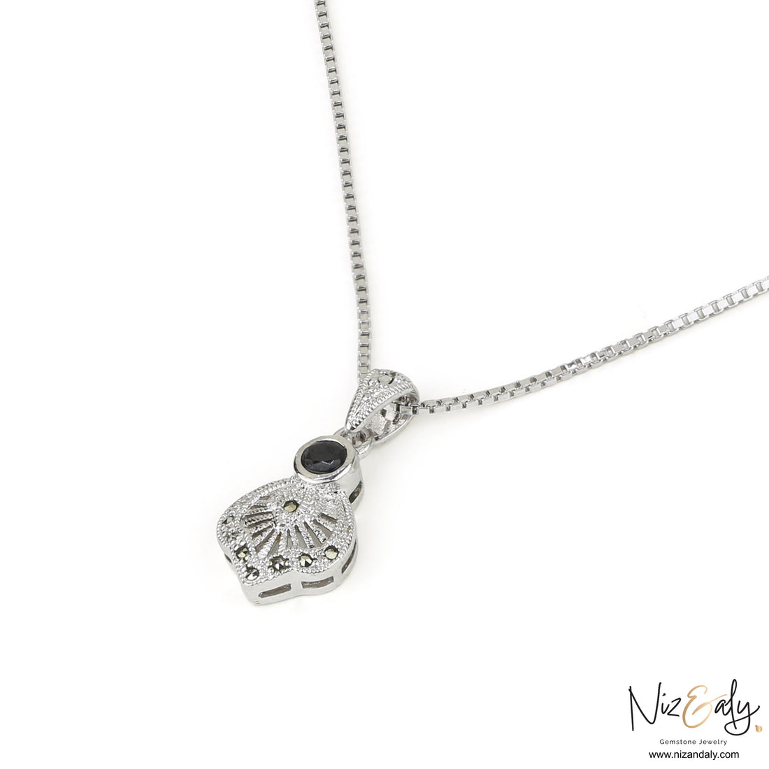 Niz & Aly sterling silver pendant featuring a black agate stone and vintage star motif on a delicate box chain