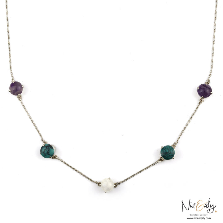 Niz & Aly sterling silver necklace featuring amethyst, turquoise, and milky quartz stones on a delicate chain.