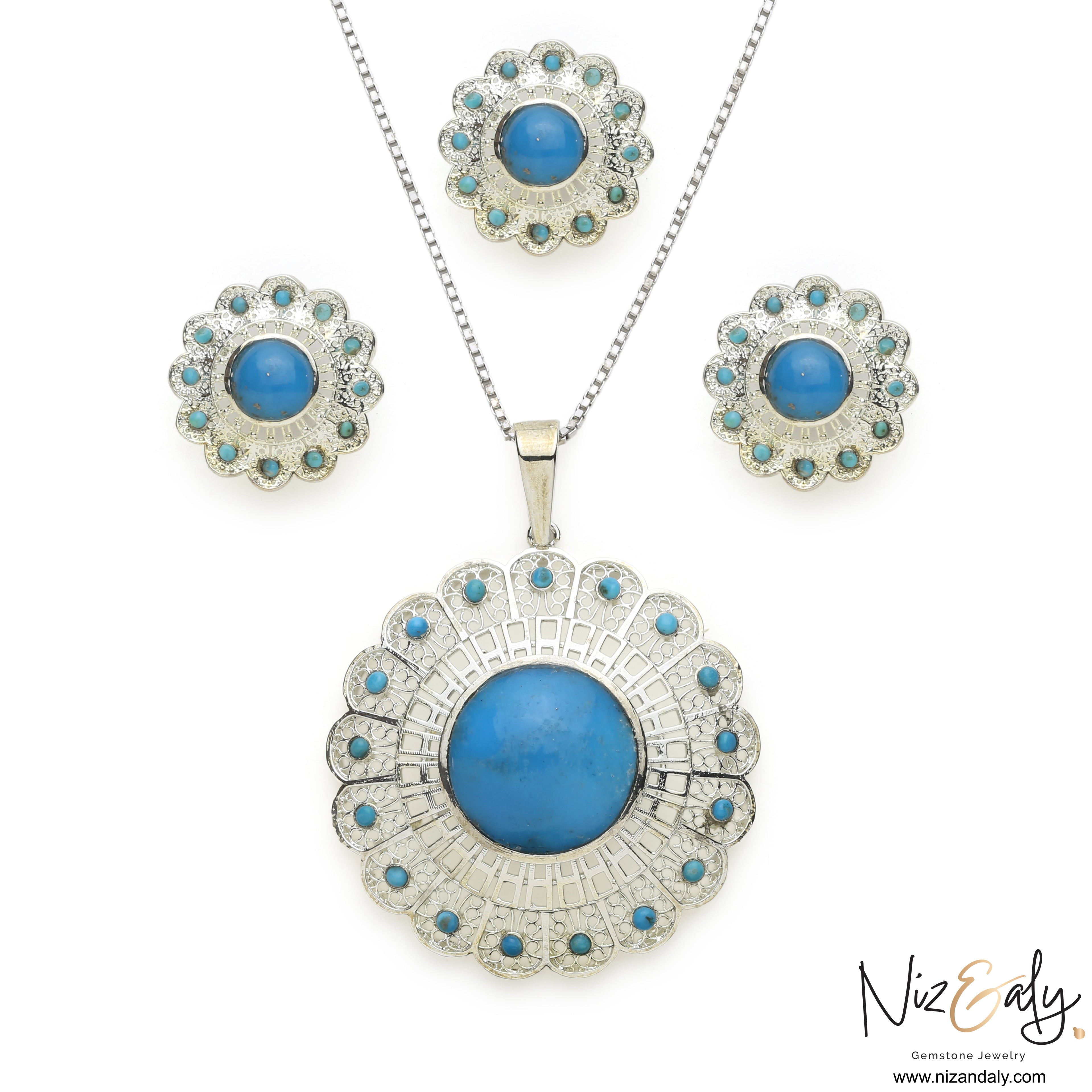 Niz & Aly sterling silver turquoise pendant and earring set with floral filigree and blue gemstone accents.