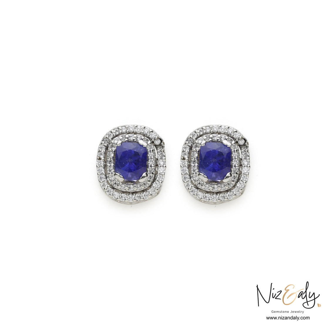 Niz & Aly tanzanite stud earrings featuring cushion-cut blue gemstones with a double halo of sparkling white stones.