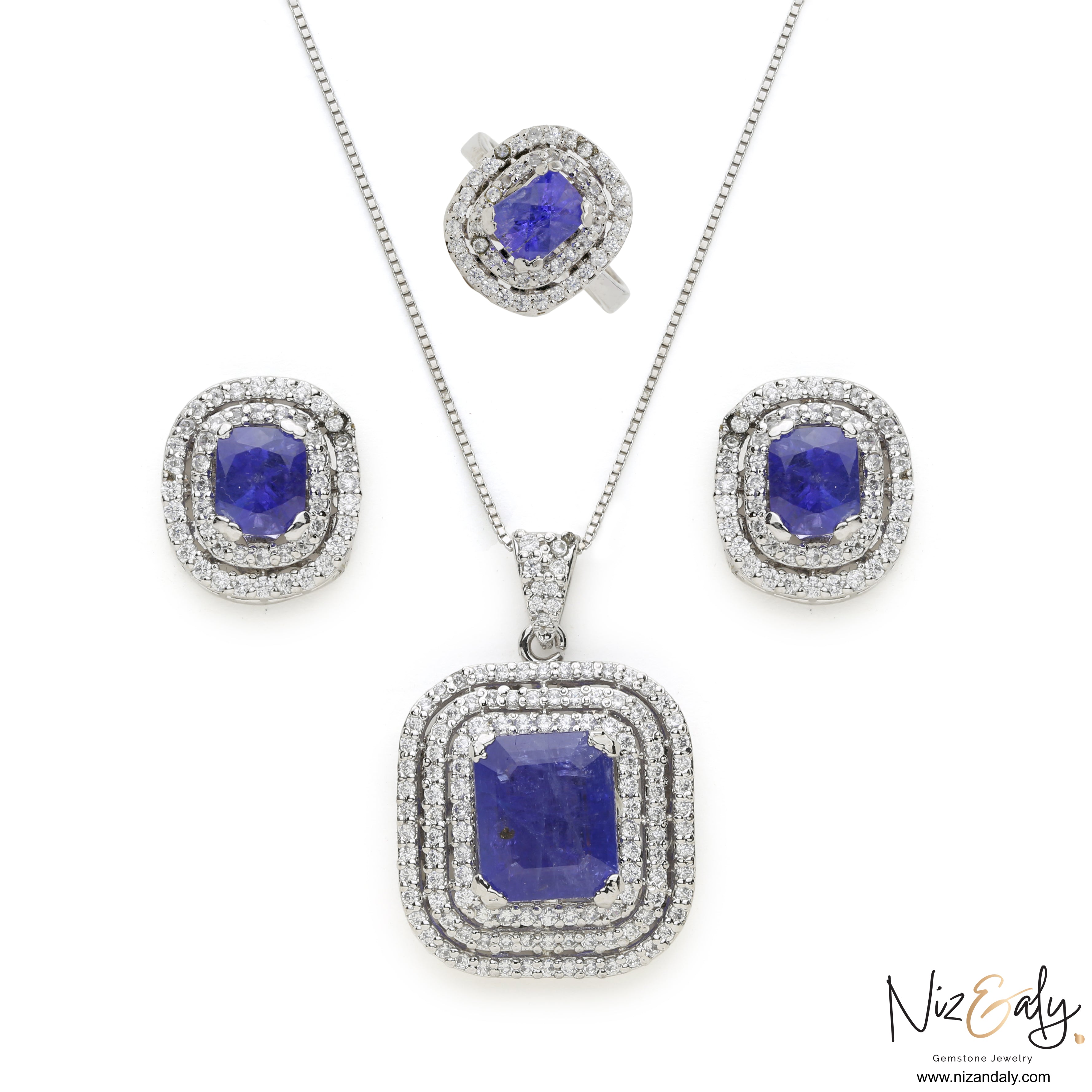 Niz & Aly lavender blue tanzanite jewelry set featuring a pendant, earrings, and ring in sterling silver with halos.