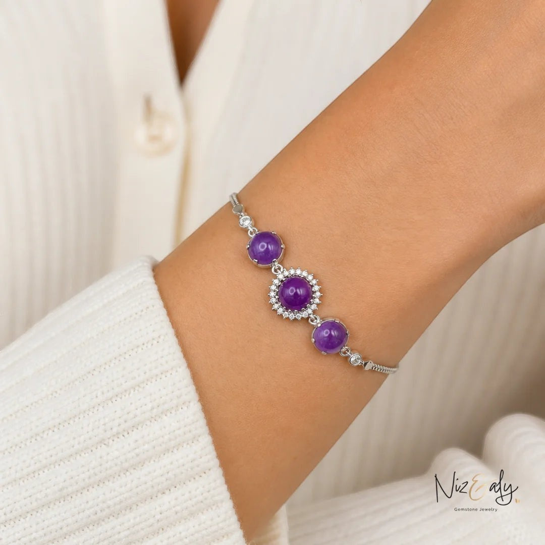 Niz & Aly triple amethyst bracelet featuring three purple gemstone beads surrounded by sparkling crystals on a silver chain