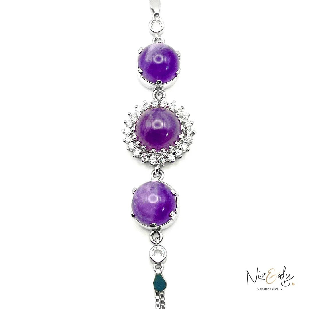 Niz & Aly triple amethyst bracelet featuring three round purple gemstone beads set in silver with sparkling accents.