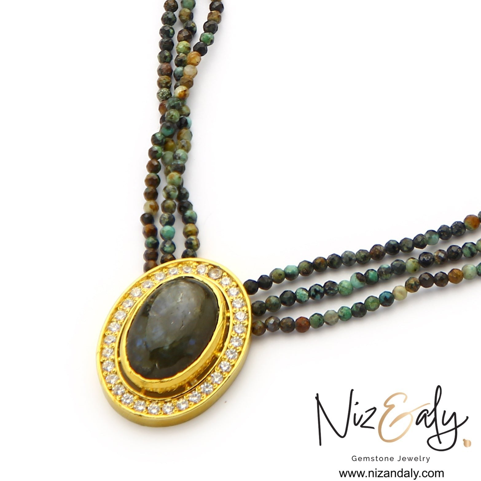 Niz & Aly triple strand necklace with faceted earth-toned gemstone beads and an oval center stone with a crystal halo.