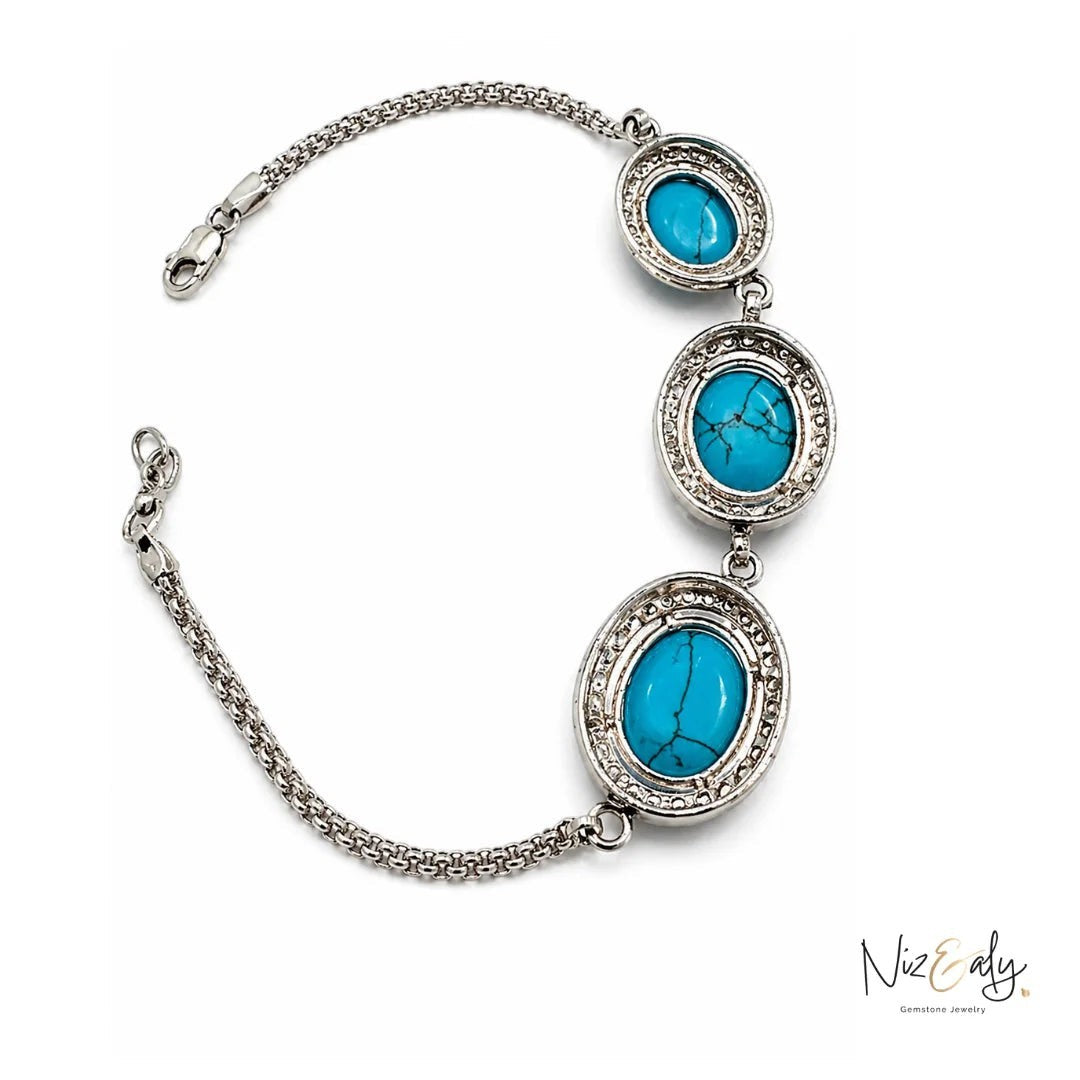 Niz & Aly turquoise blue howlite bracelet featuring three oval polished stones set in silver-tone metal chain links.