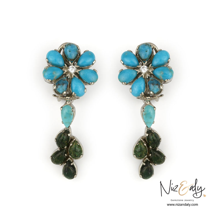 Niz & Aly turquoise and green leaf chandelier earrings featuring a floral design with a central diamond accent.