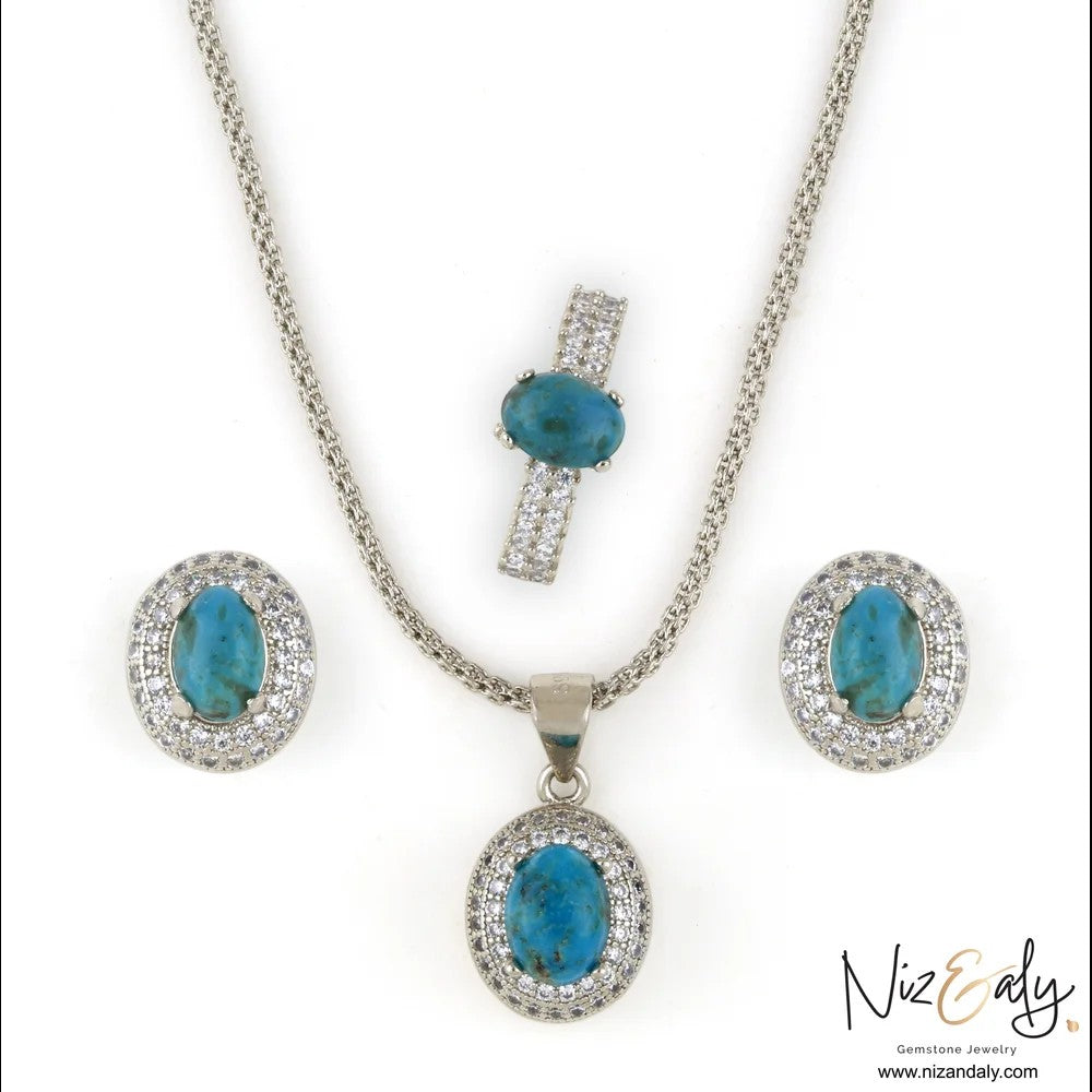 Niz & Aly jewelry set featuring oval turquoise gemstones with cubic zirconia halos in a silver-toned finish.