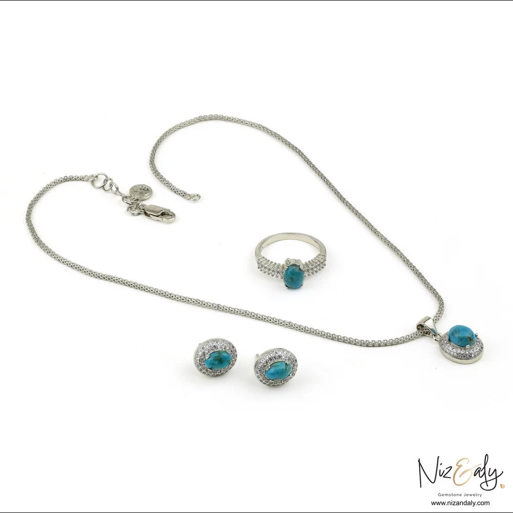 Niz & Aly jewelry set featuring oval turquoise gemstones with cubic zirconia halos in a polished silver-tone setting.