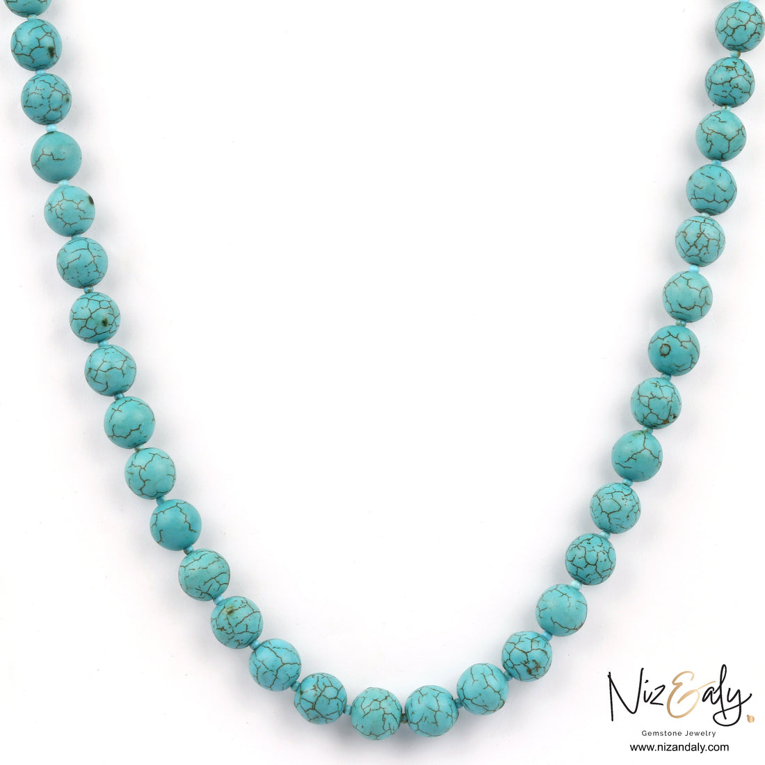 Niz & Aly turquoise howlite beaded necklace with marbled sky-blue stones and dark veining on a white background.