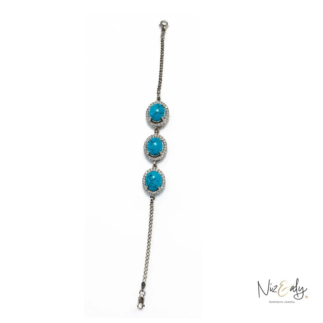 Niz & Aly turquoise blue howlite bracelet featuring three round polished stones in silver settings with crystal accents