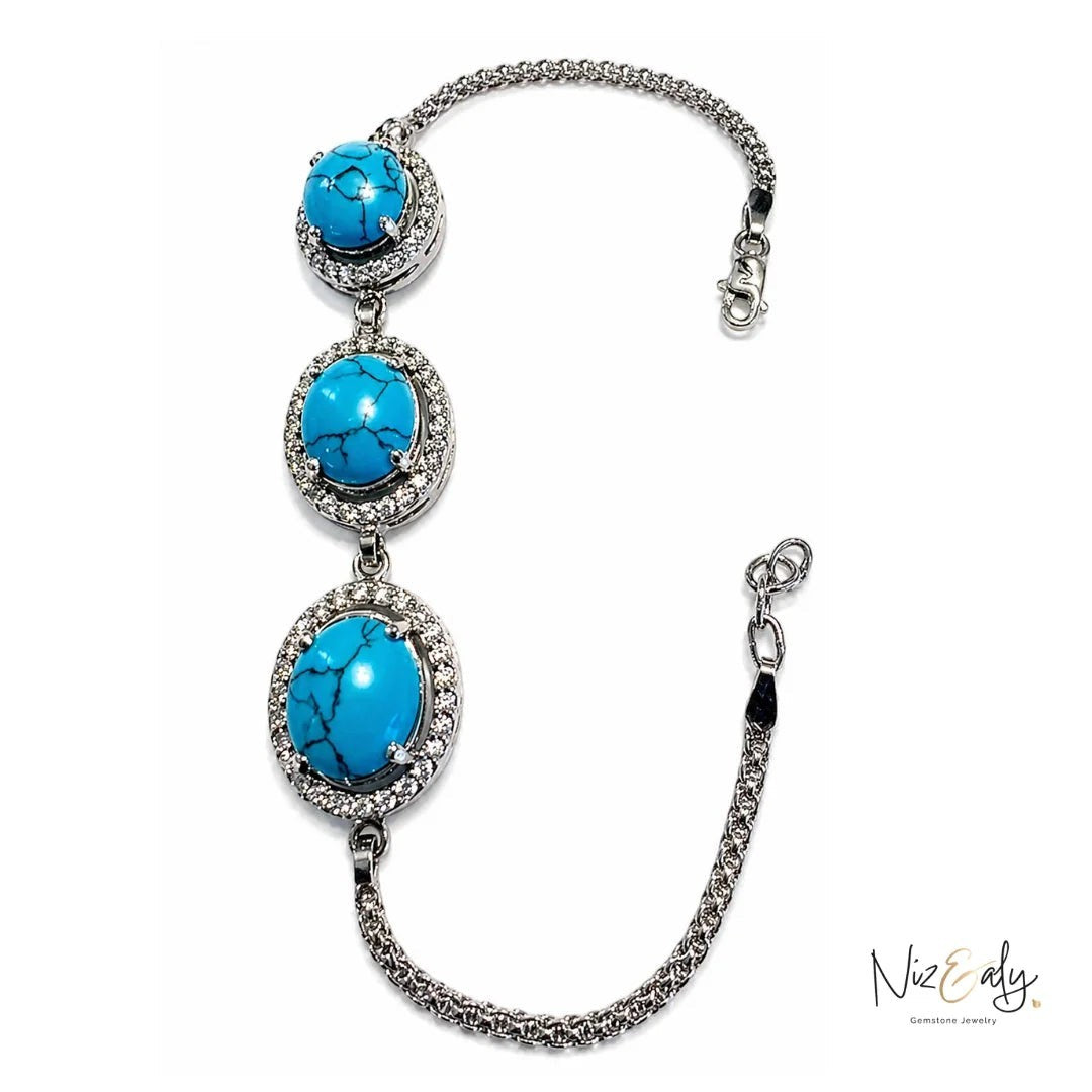 Niz & Aly turquoise blue howlite bracelet featuring three oval gemstones in silver settings with crystal accents.