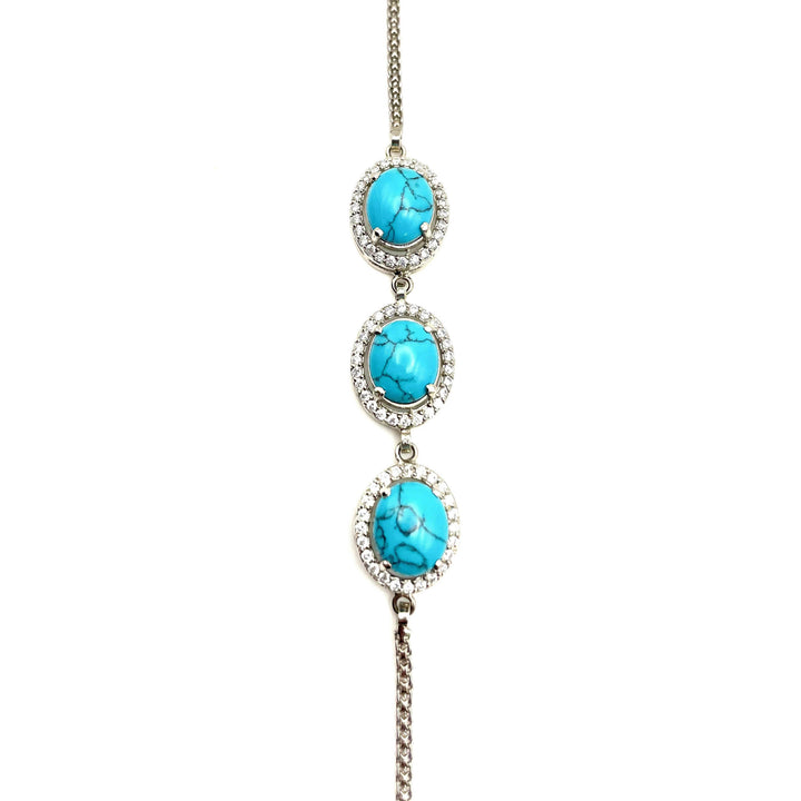 Niz & Aly turquoise blue howlite bracelet featuring three oval stones set in silver with sparkling crystal accents.