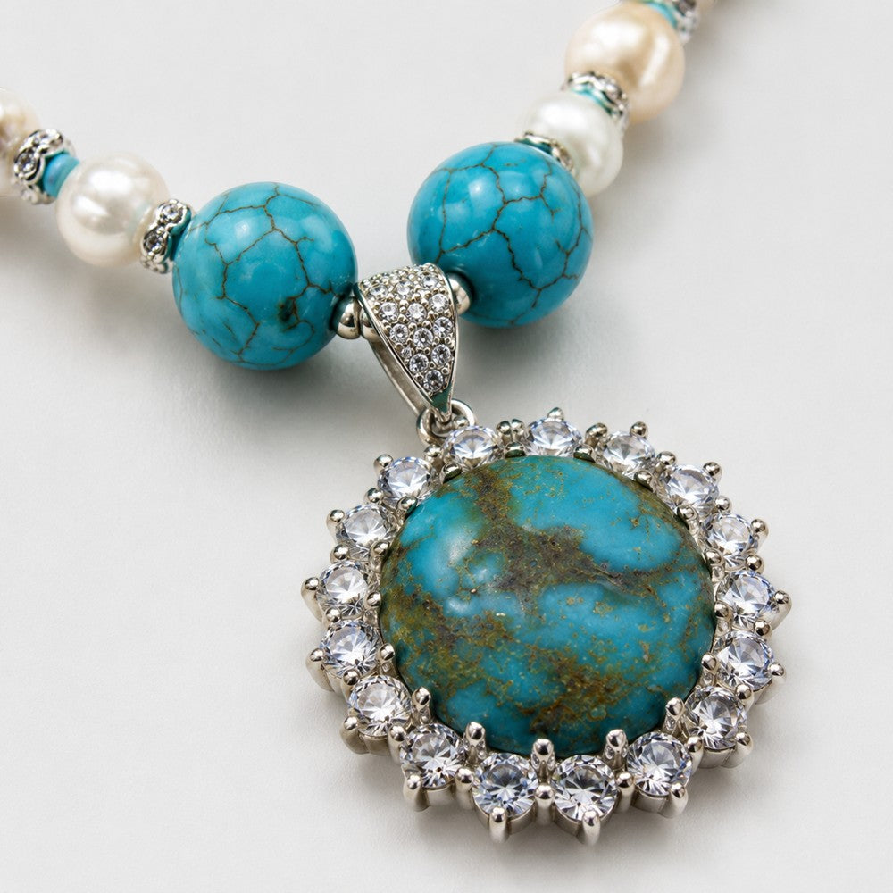 Niz & Aly Kingman turquoise pendant necklace with white pearls and sparkling silver crystal halo setting.
