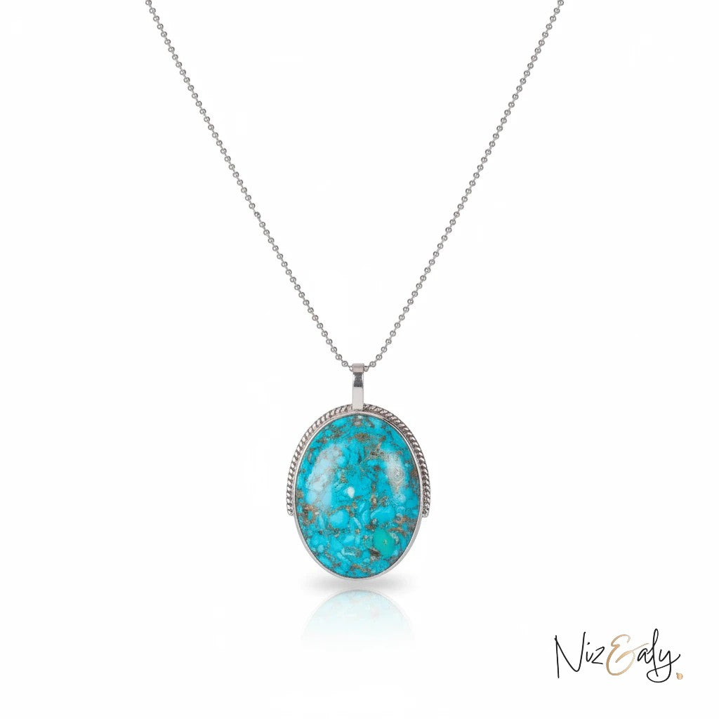 Niz & Aly turquoise and pyrite oval pendant necklace on a delicate silver chain with boho style.