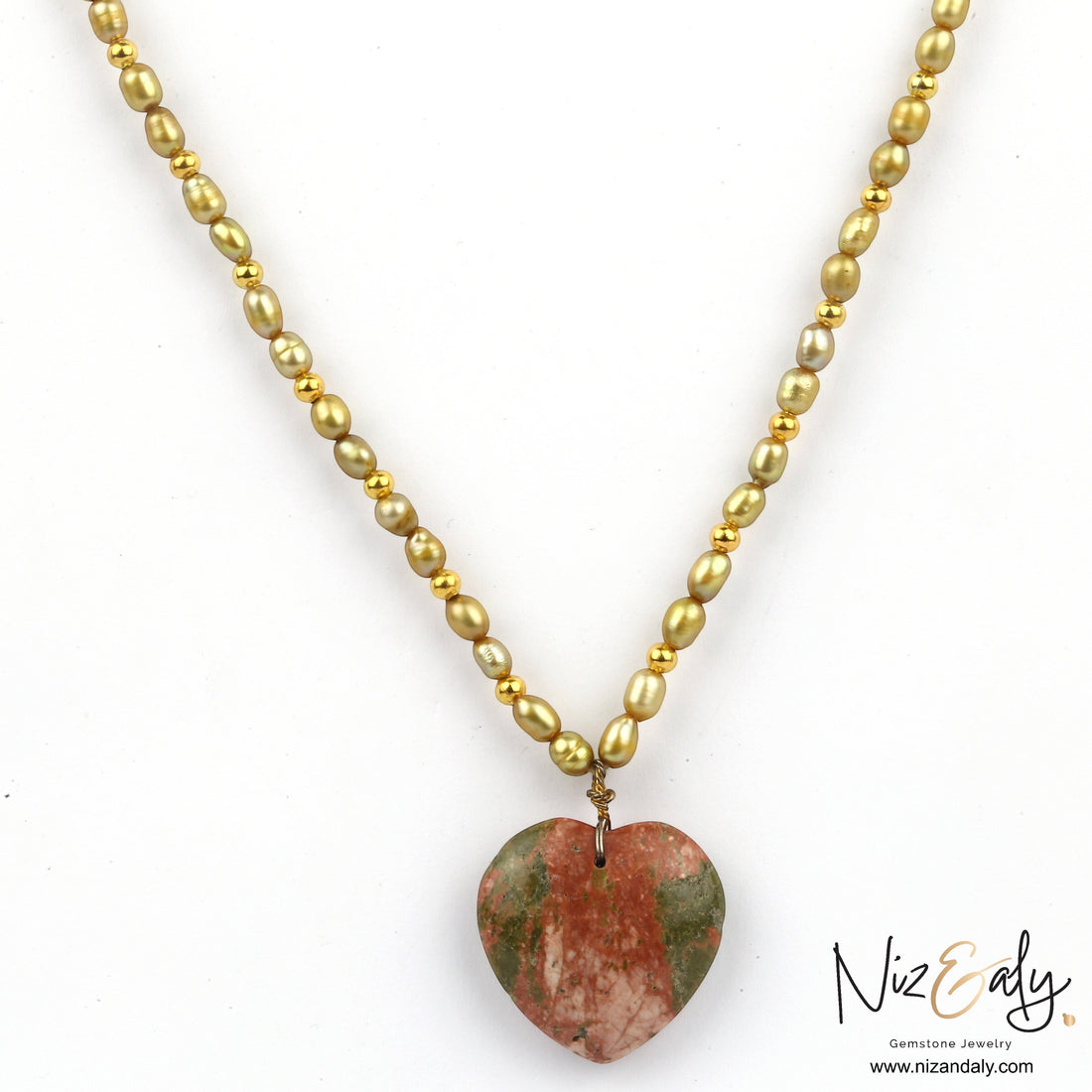 Niz & Aly unakite heart pendant necklace featuring a strand of golden rice pearls and small gold beads.