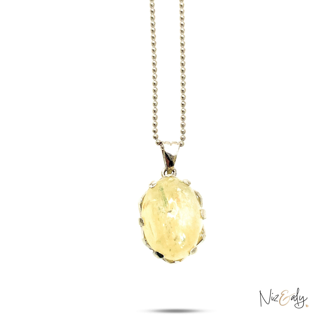 Niz & Aly natural untreated citrine locket pendant on a delicate silver ball chain with a golden yellow gemstone.