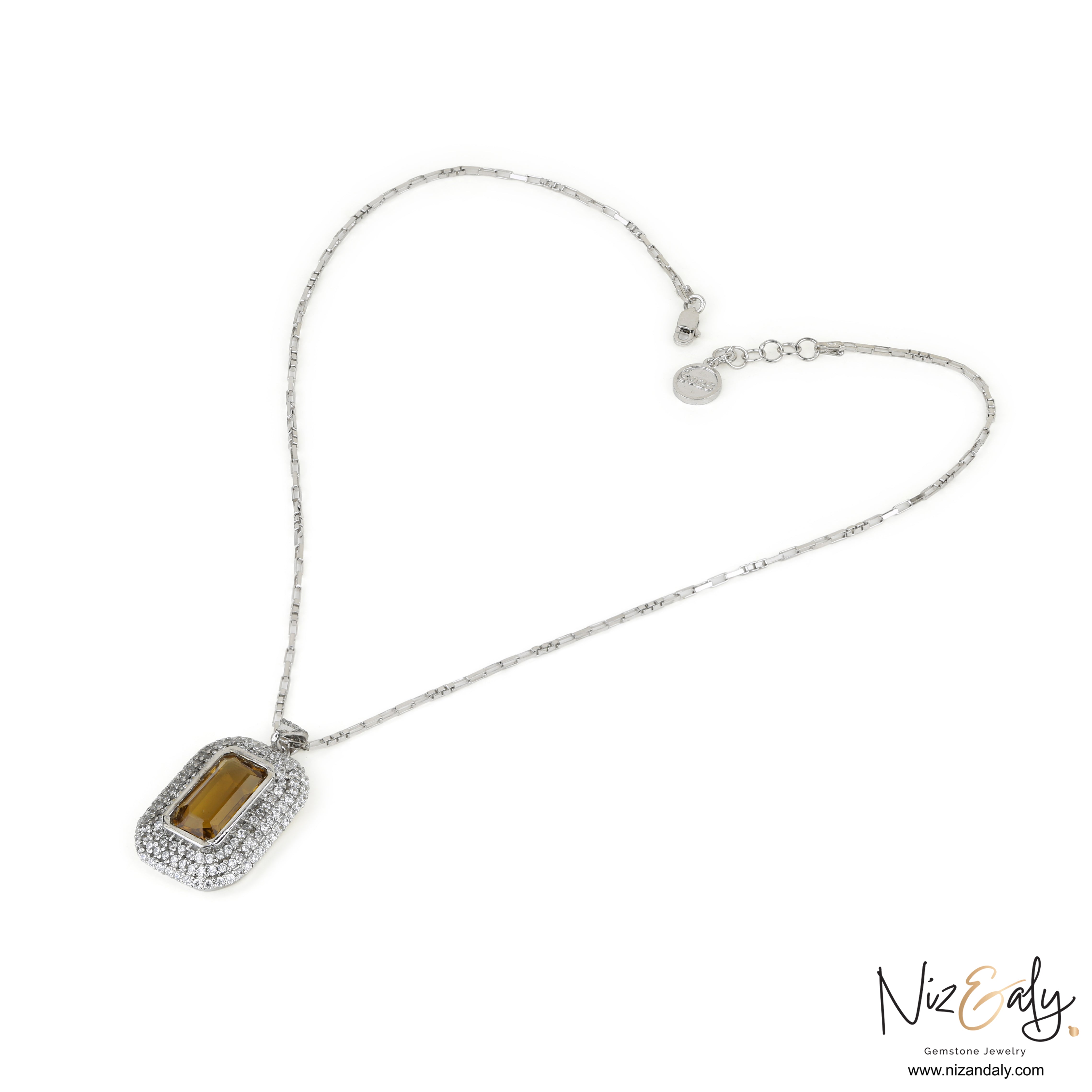 Niz & Aly yellow amethyst pendant necklace with a rectangular gemstone surrounded by sparkling white stones on a chain