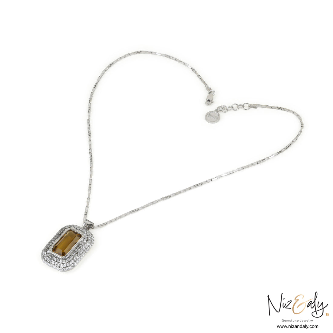 Niz & Aly yellow amethyst pendant necklace with a rectangular gemstone surrounded by sparkling white stones on a chain