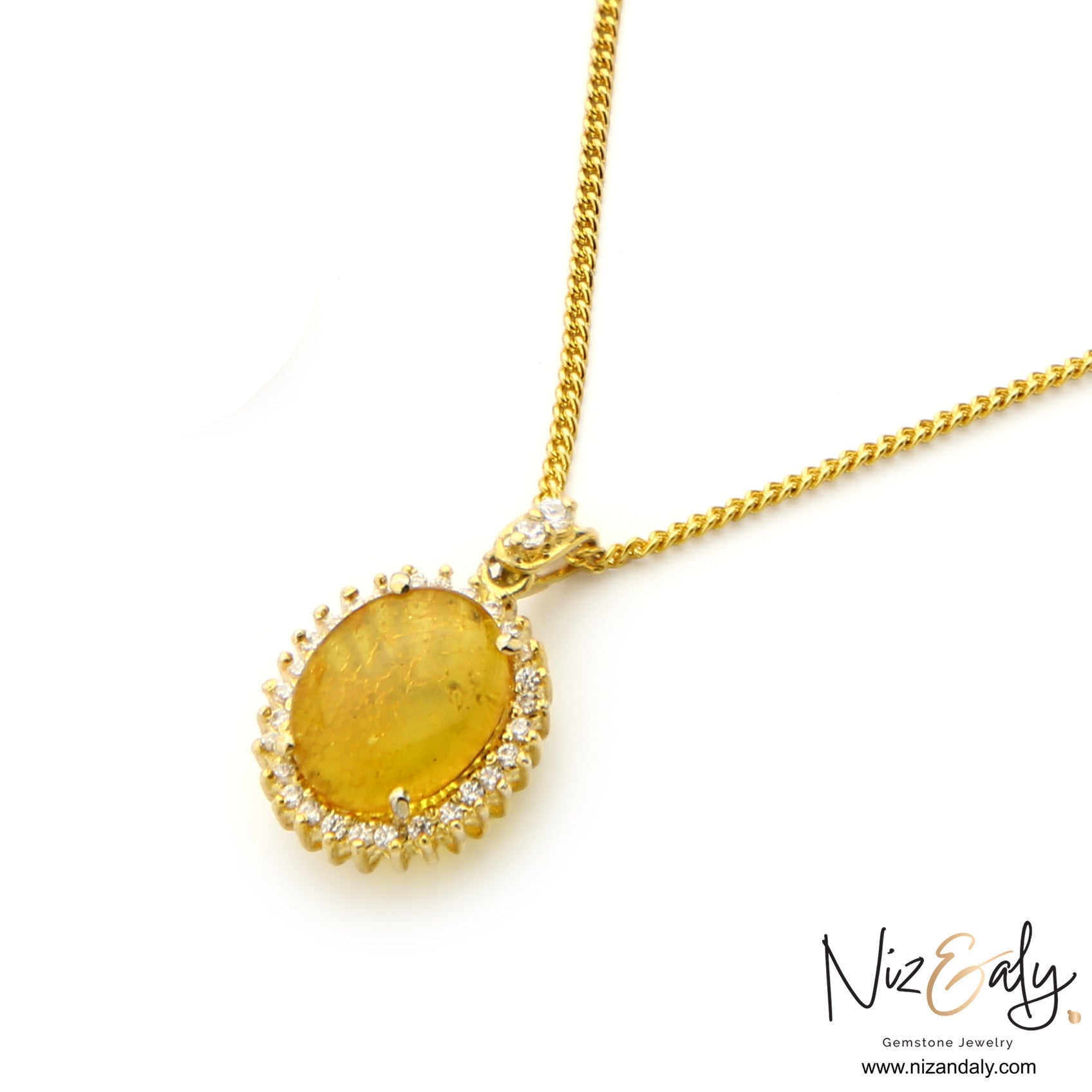 Niz & Aly yellow Baltic amber pendant necklace featuring an oval gemstone with a sparkling clear stone halo in gold